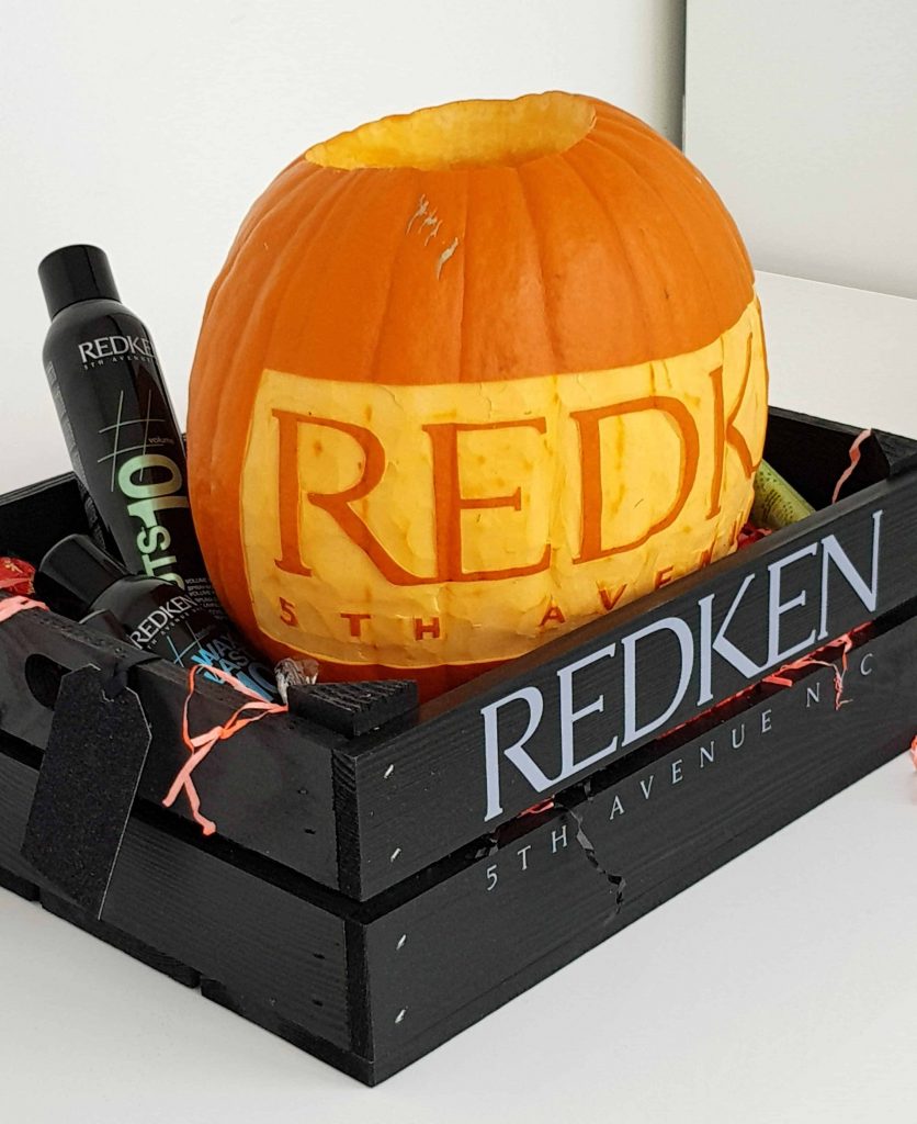 REDKEN branded pumpkin created by our Halloween Pumpkin Carving Artist who can provide online tutorials for guests on Zoom calls this Halloween.