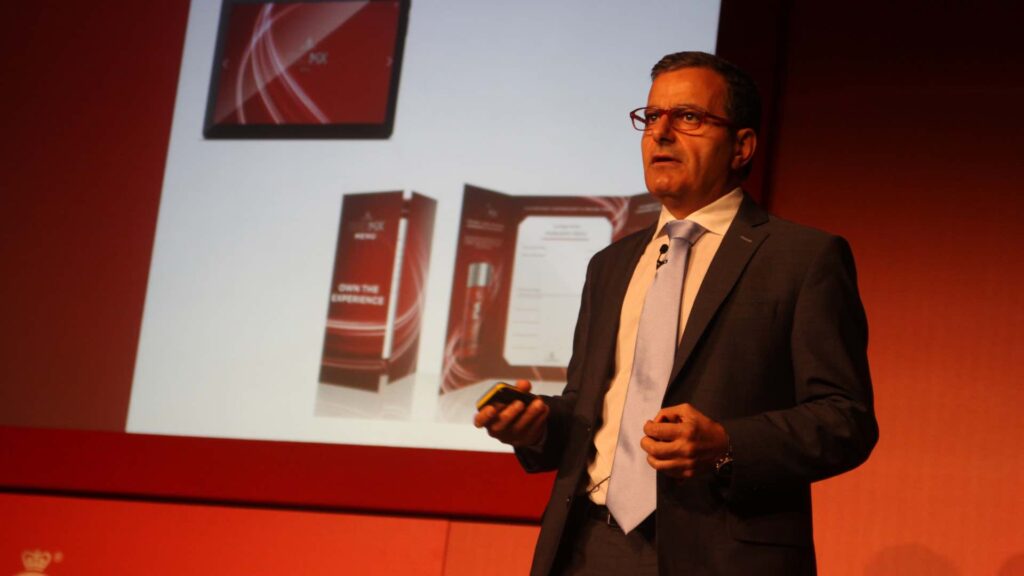 Speaker giving speech at product launch event for red mix.