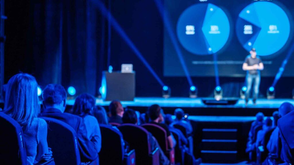 Sales Kick-Off stage design enhanced with lighting and AV services.