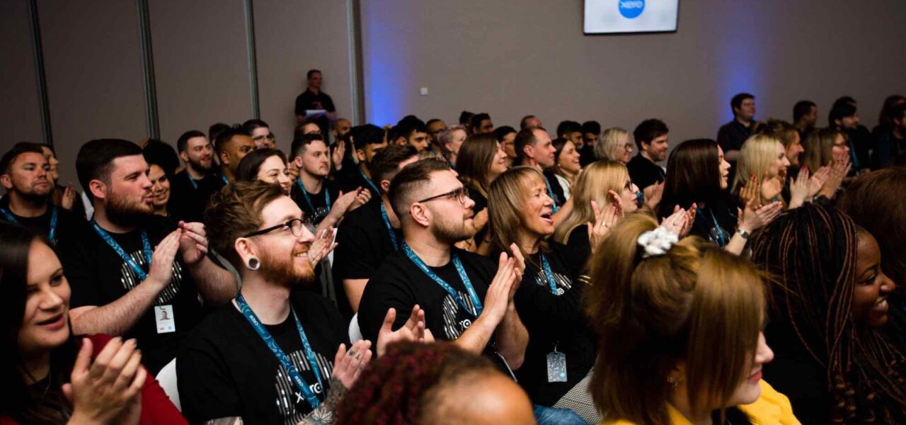 Sales-Kickoff-Attendees-Engaging-In-Event