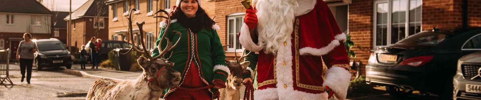 Santa-And-Elf-Helpers-With-Reindeer