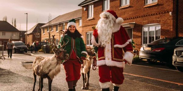 Santa-And-Elf-Helpers-With-Reindeer