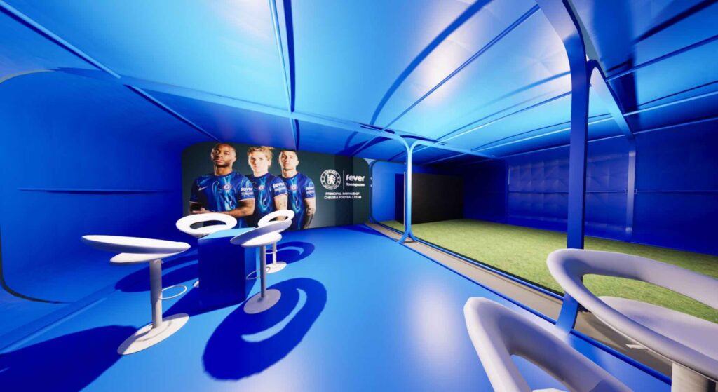 A custom made fan zone engagement zone design with blue decor and white seating.