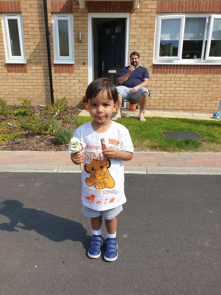 Child enjoying ice cream at our Socially Distanced outdoor event we created and managed for Simple Life.