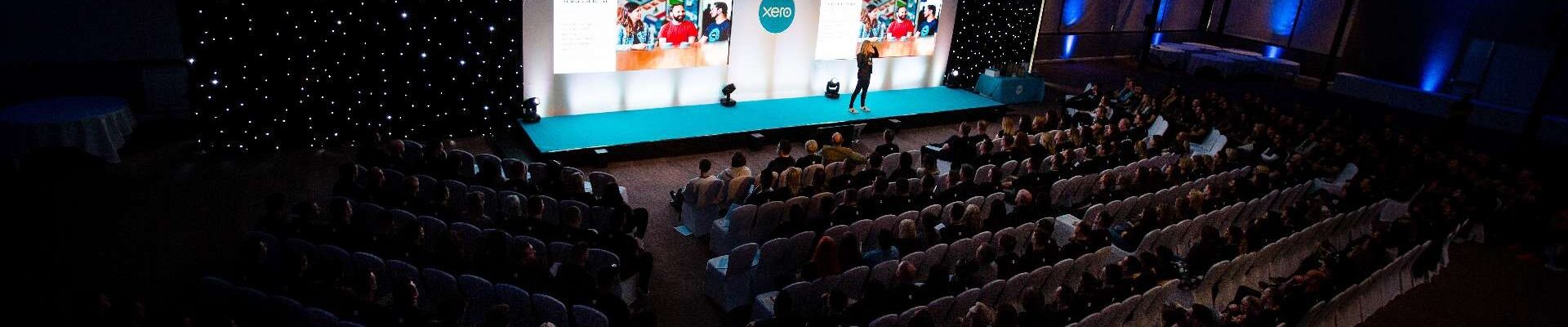 Speaker-On-Stage-At-Corporate-Conference-Near-London
