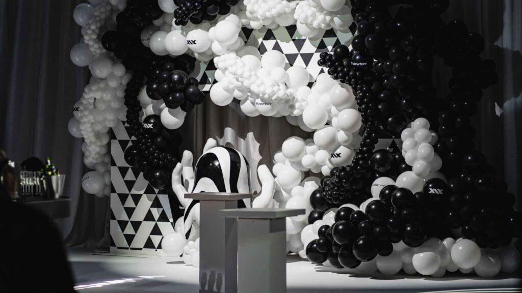 Bespoke black and white balloon event installation designed for an event by professional product launch event company.