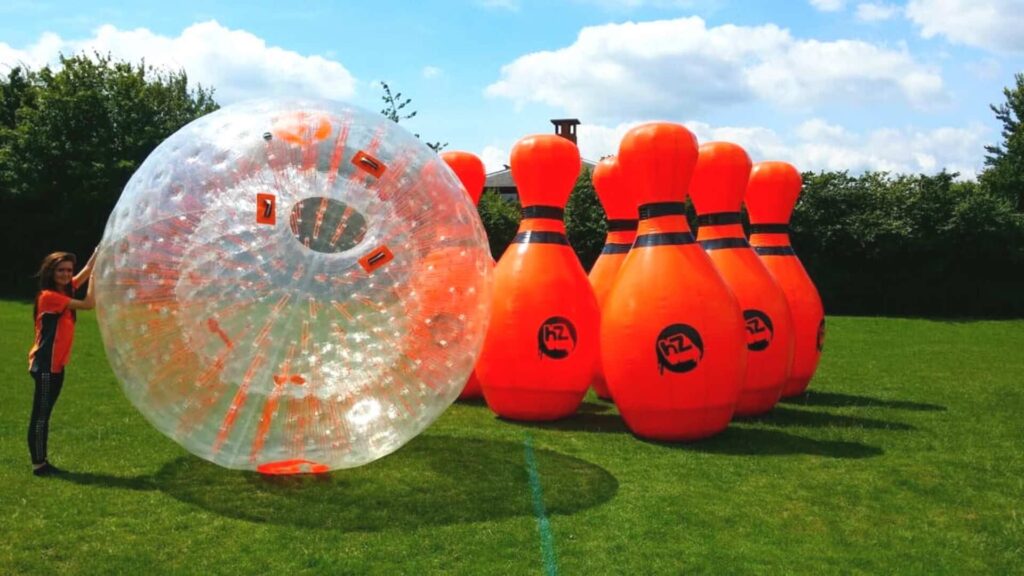 Large inflatable zorbing ball with inflatable bowling pins