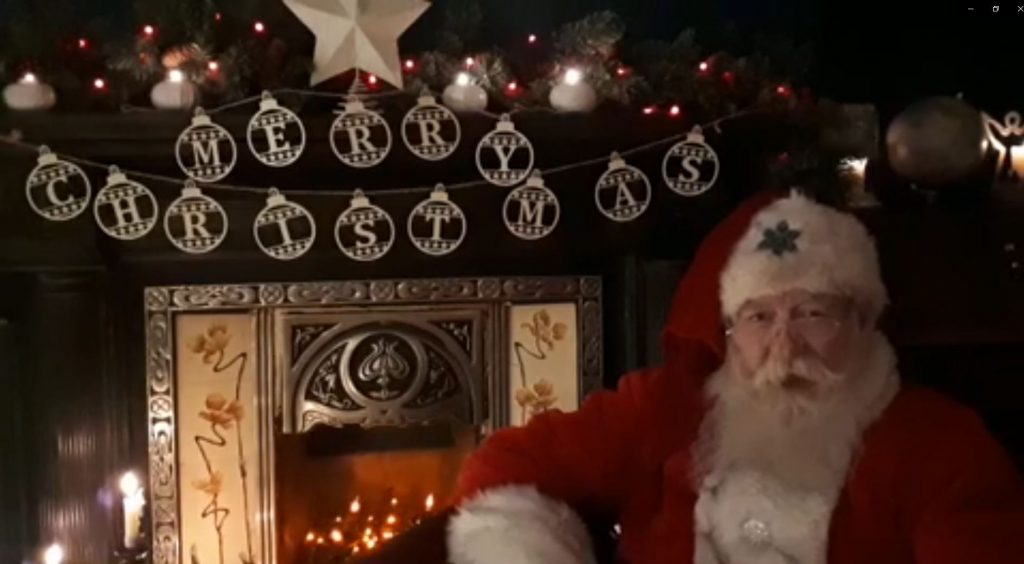 Our Santa Claus performer delivering a personalised message to clients on a Virtual Christmas Grotto Experience.
