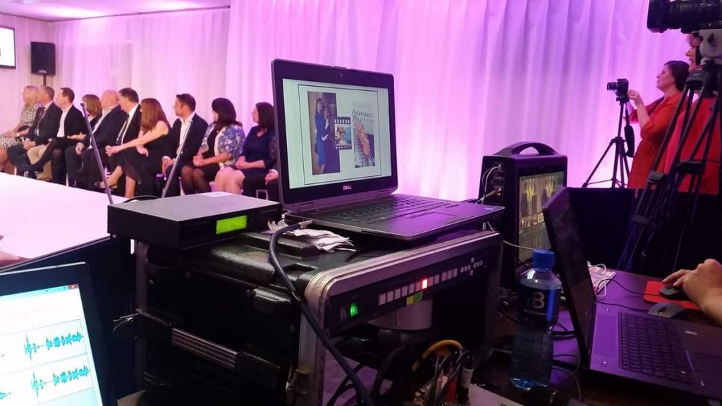 Hybrid event being streamed to virtual audience.
