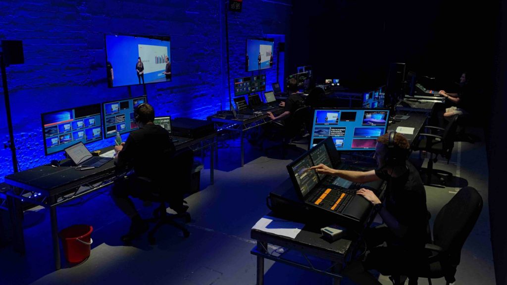 Team managing hybrid event in an event studio.