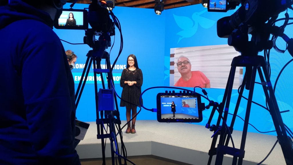 Filming in studio for virtual conference event.