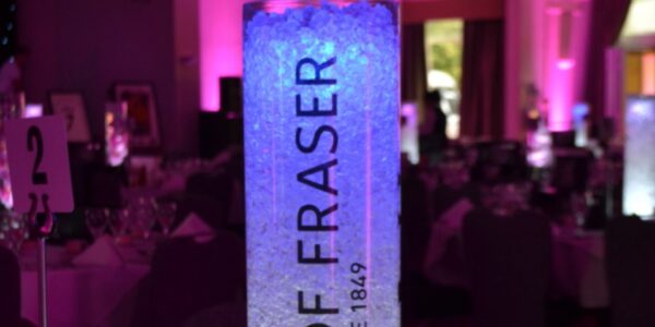 House of Fraser ice tube bespoke branded table centrepieces used for a gala event added style to the table design.