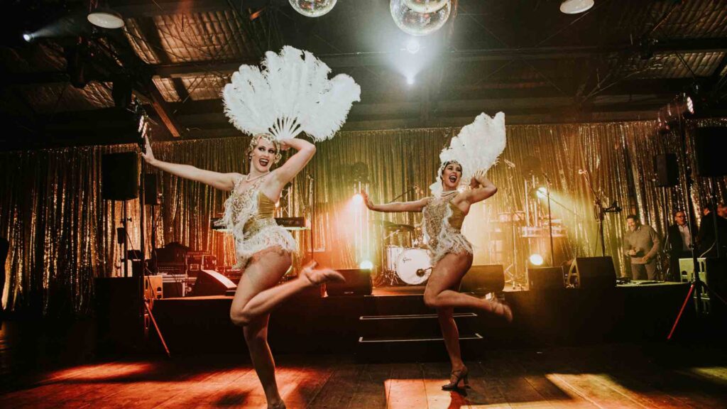 1920s themed gatsby girls with feathered headdress for themed events