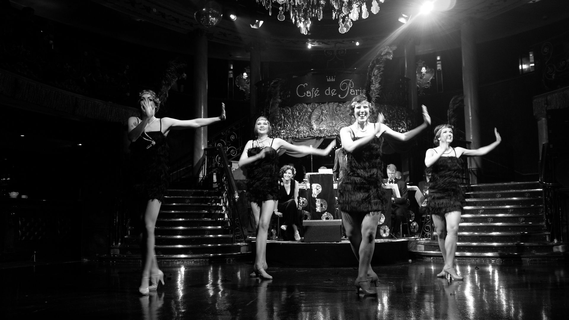 Black and white photo of group of gatsby girls dancing the charleston