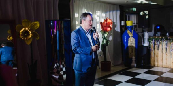 Guest-Giving-Speech-At-Alice-In-Wonderland-Christmas-Party