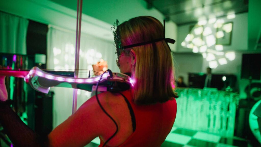 Book captivating musicians for your Corporate Christmas parties such as LED violinists.
