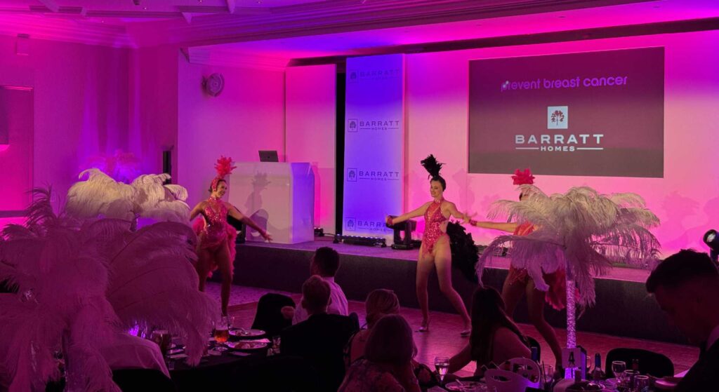 Show girls performing routine at Barratt Homes charity gala.