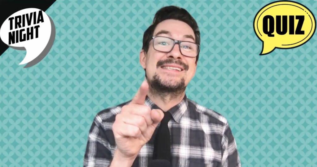 Quiz Master pointing to the camera. Take a look at our range of Interactive Online Games.