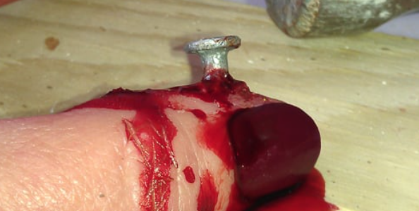 SFX-Halloween-Makeup-Artist-Nail-In-Thumb