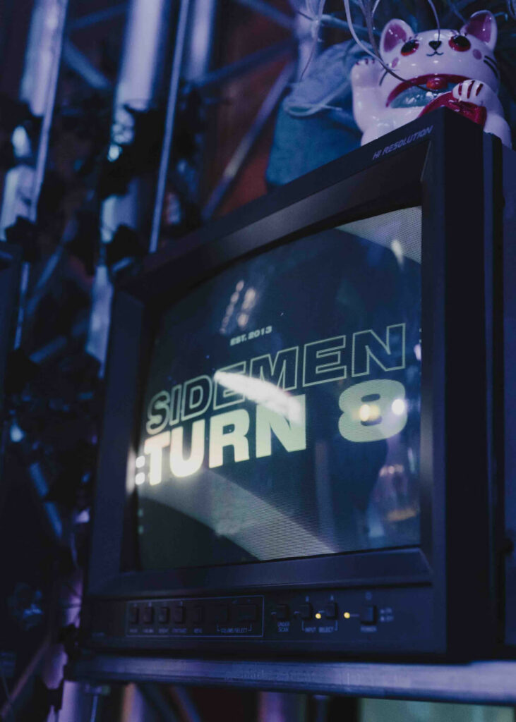 Sidemen turn 8 logo displayed on old fashioned box TV used as part of prop installation for Sidemen event.