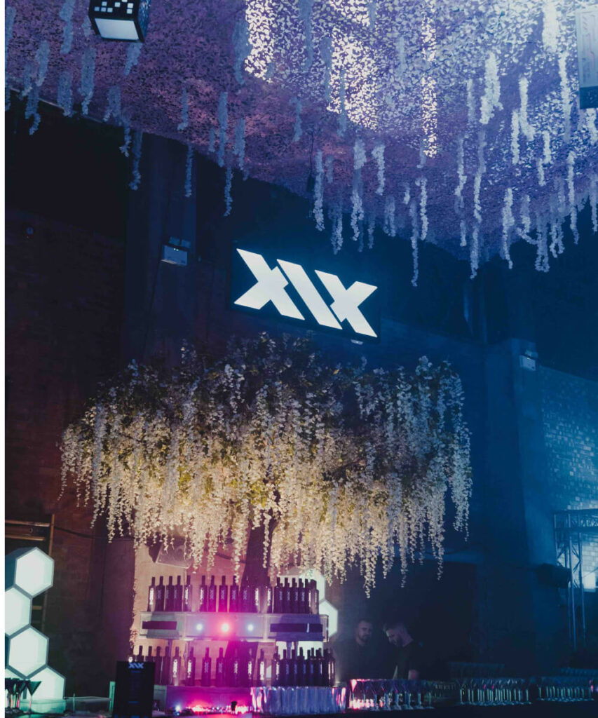 XIX Vodka light up sign above bar.