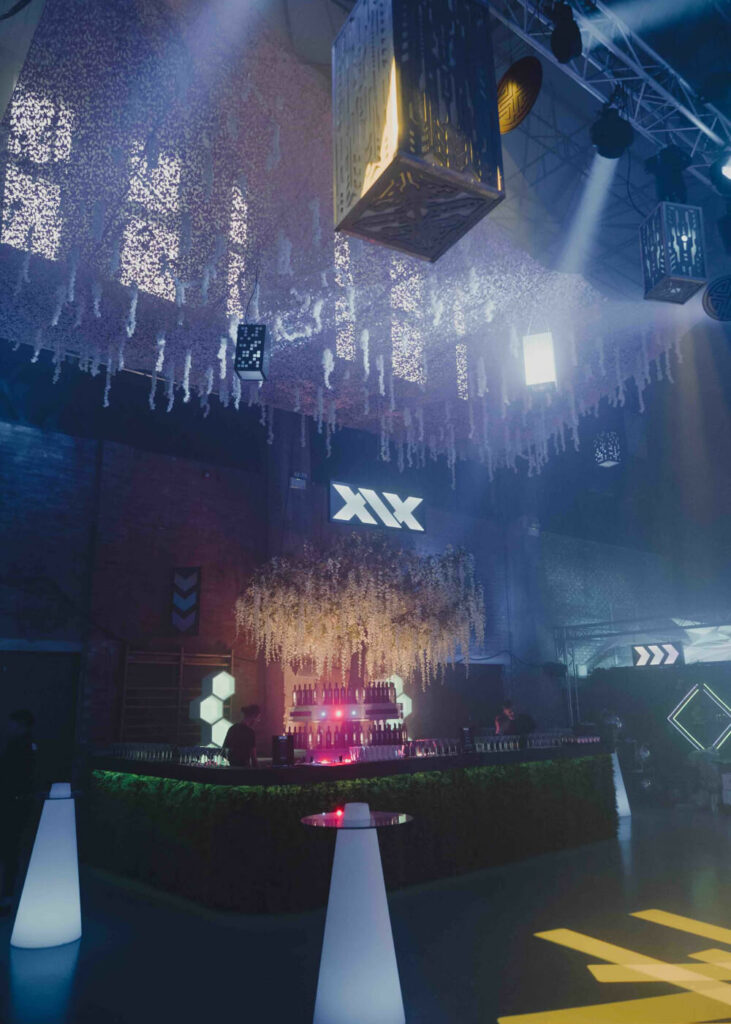XIX Vodka bar we created at Sidemen event featuring giant wisteria tree, bespoke signage and custom lighting.