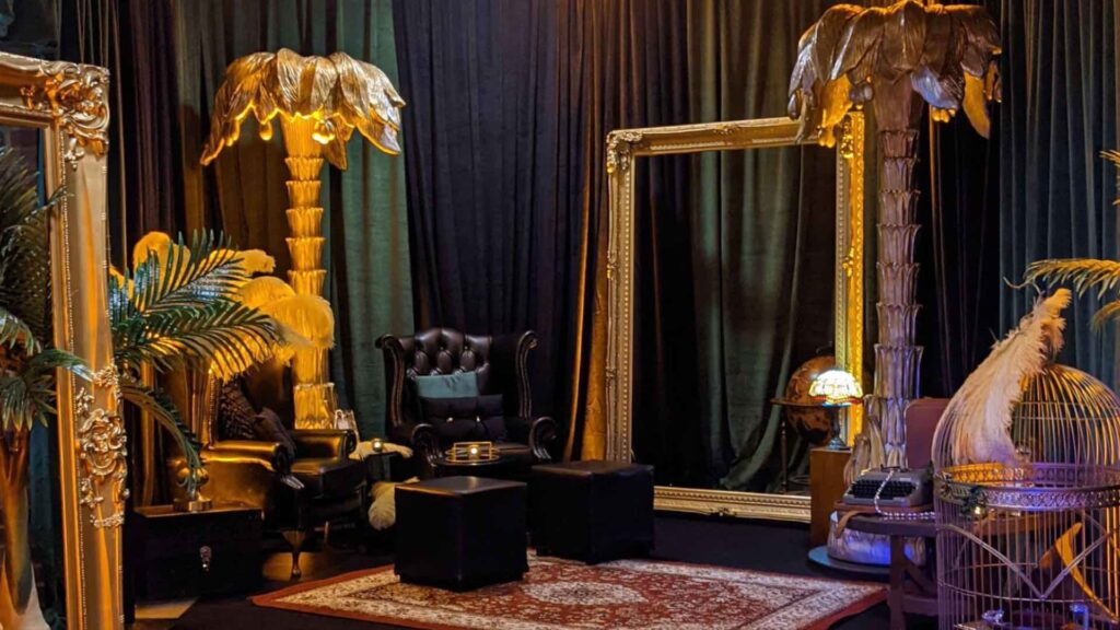 1920's themed black and gold props and furniture in event space.