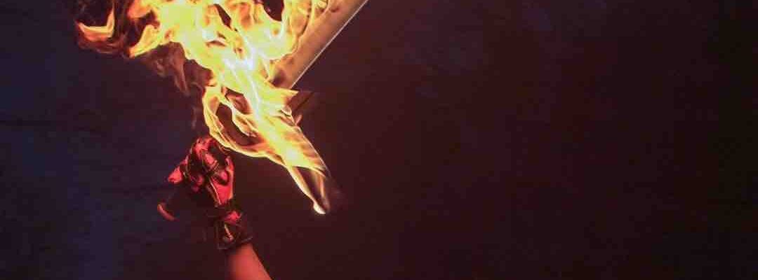 Fire-Performer-With-Flaming-Sword Fire-Performer-With-Flaming-Sword