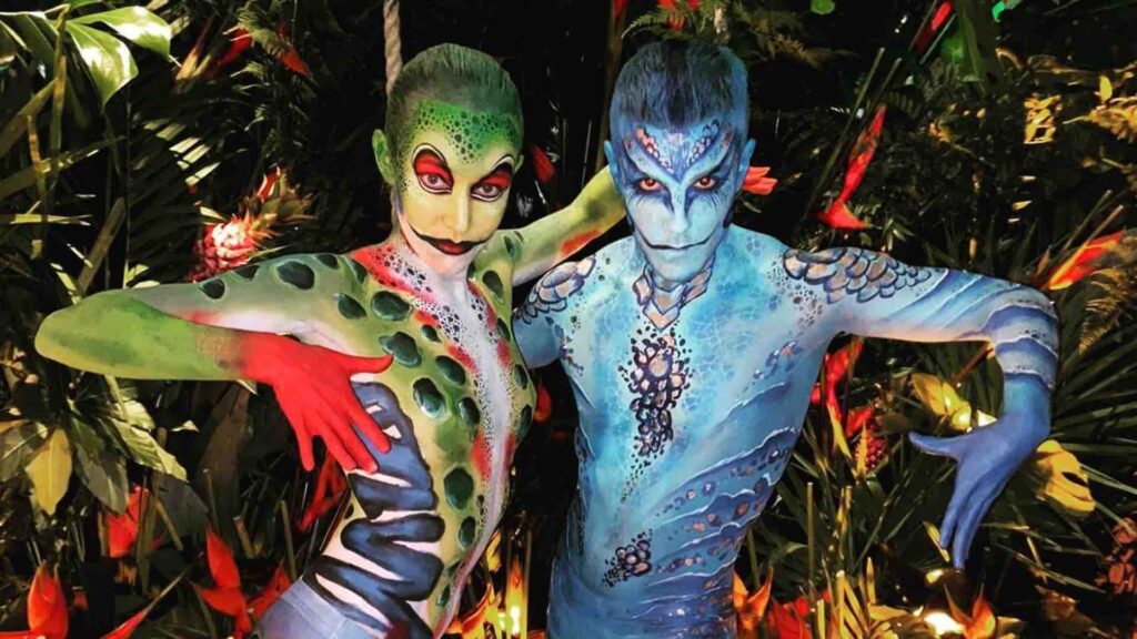 Human reptile walkabout entertainers painted by professional face and body painters for hire ideal for Festival Themed Entertainment.