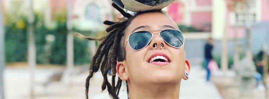 Spanish-Female-Football-Freestyler-Balances-Football-On-Head Spanish-Female-Football-Freestyler-Balances-Football-On-Head