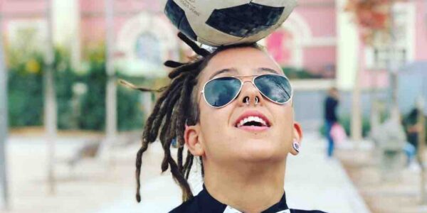 Spanish-Female-Football-Freestyler-Balances-Football-On-Head