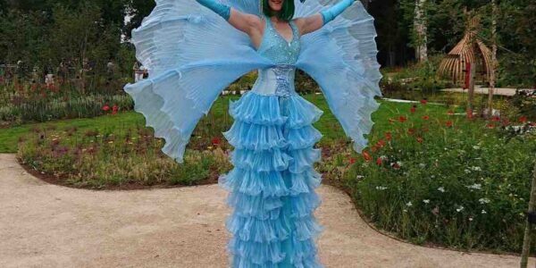 Blue-Flower-Stilt-Walker-At-Outdoor-Event
