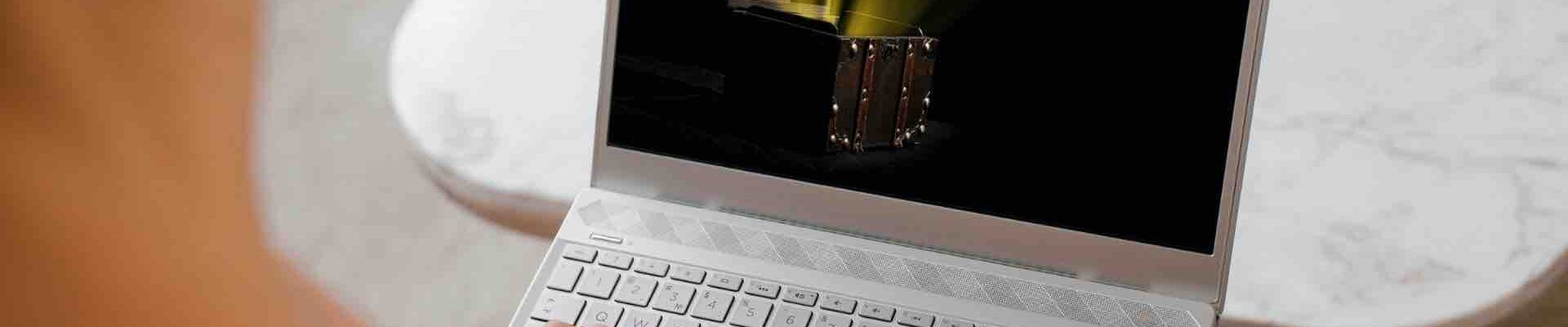 Person-On-Laptop-Playing-Treasure-Hunt-Escape-Room Person-On-Laptop-Playing-Treasure-Hunt-Escape-Room