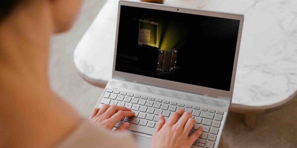 Person-On-Laptop-Playing-Treasure-Hunt-Escape-Room