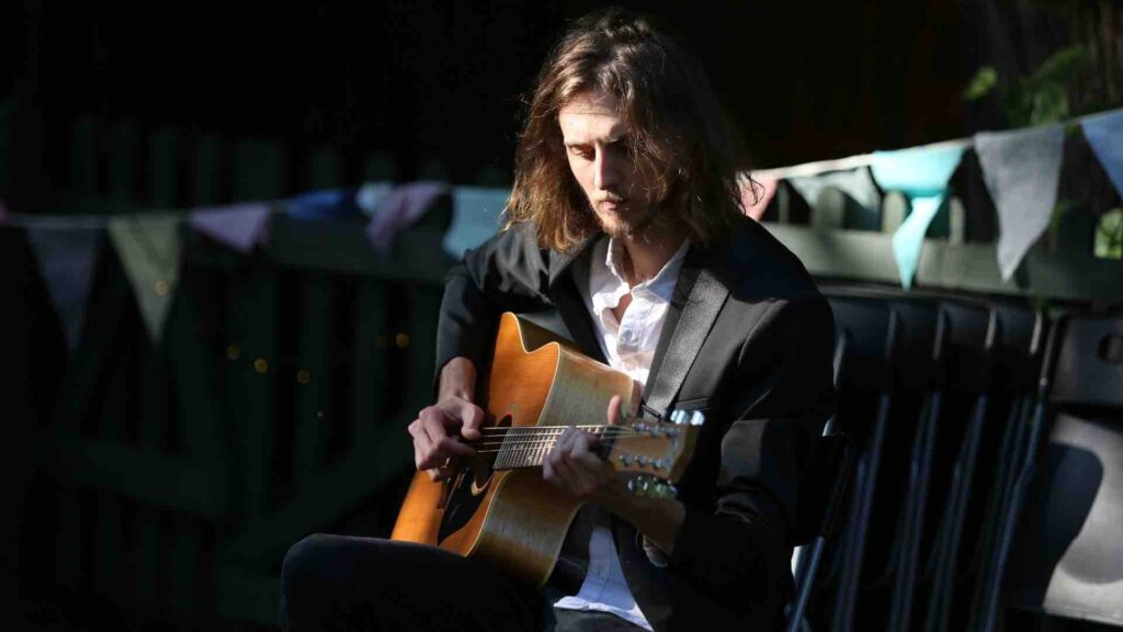 Solo guitarist playing music at festival event
