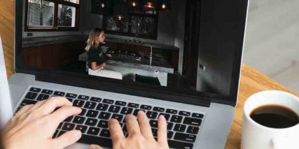 Woman-Playing-Virtual-Escape-Room-On-Laptop