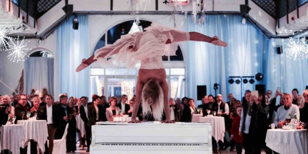 Dancer-Performs-Hand-Stand-On-Piano
