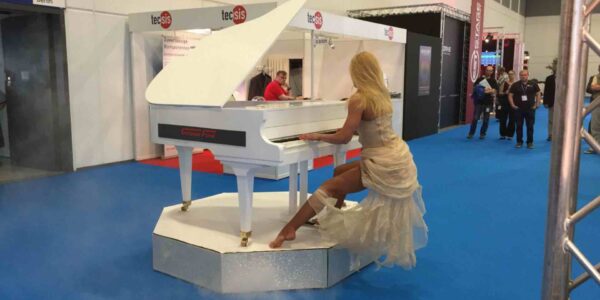 Woman-Performs-On-Moving-Piano