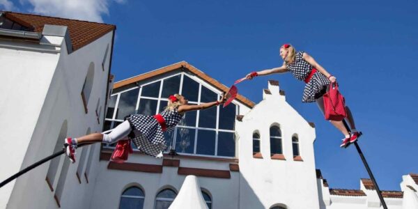Aerial-Dancers-Reach-Out-On-Sway-Poles