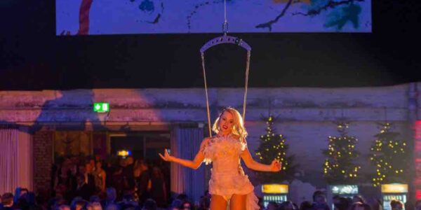 Aerialist-Hangs-From-Chandelier