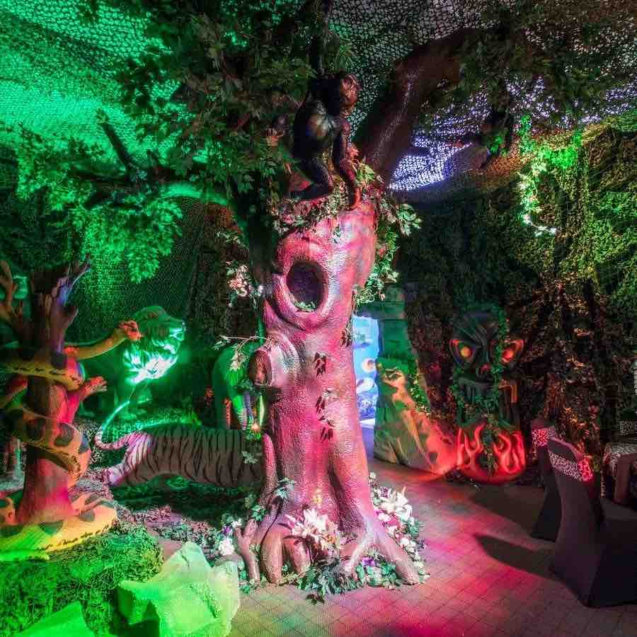 Giant Jungle tree prop booked as part of jungle themed event services.