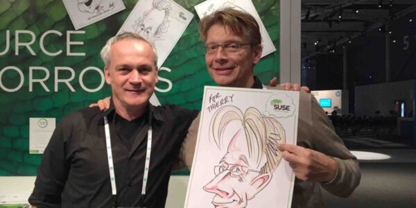 Caricature-Artist-And-Subject-Posing-For-Photo
