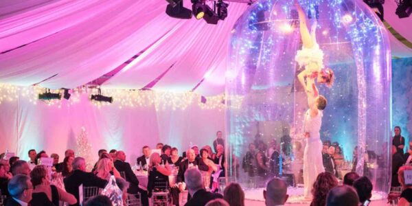 Acrobats-Performing-Inside-Snow-Globe