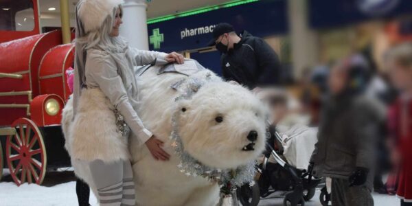 Polar-Bear-And-Handler-Greeting-Children