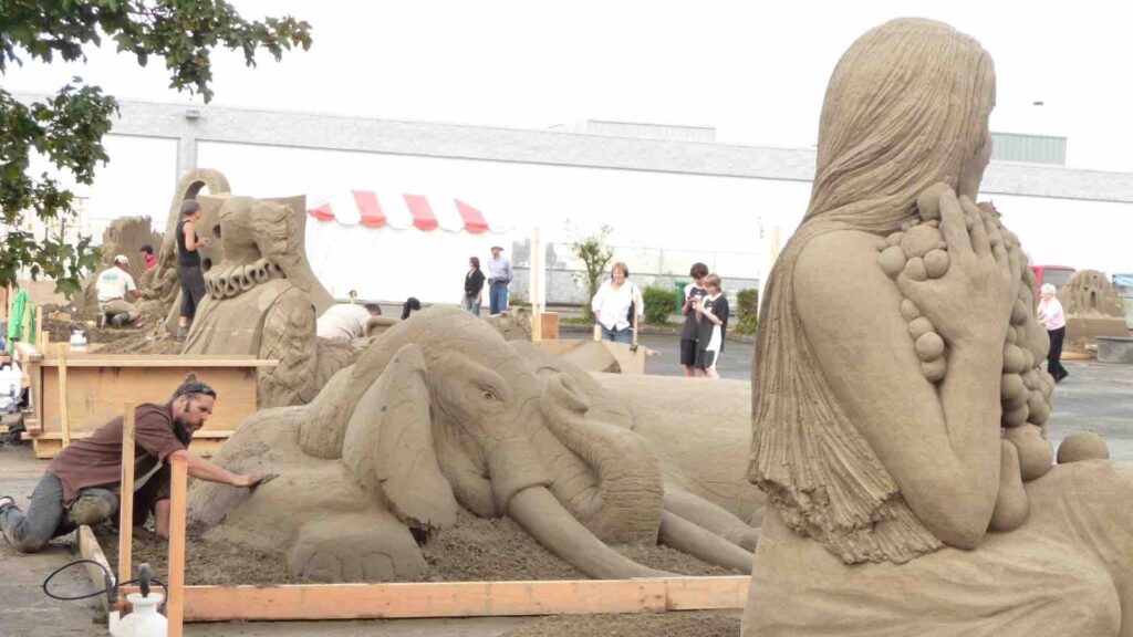 Row of sand sculptures on show at corporate event