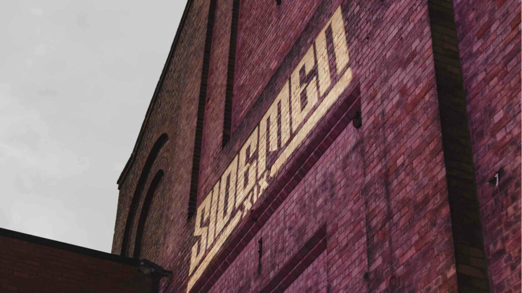 Sidemen XIX logo projected on the side of the Shoreditch Electric Light Station.
