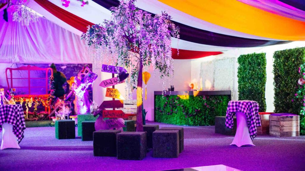 Themed seating area decorated with Alice in Wonderland themed props.