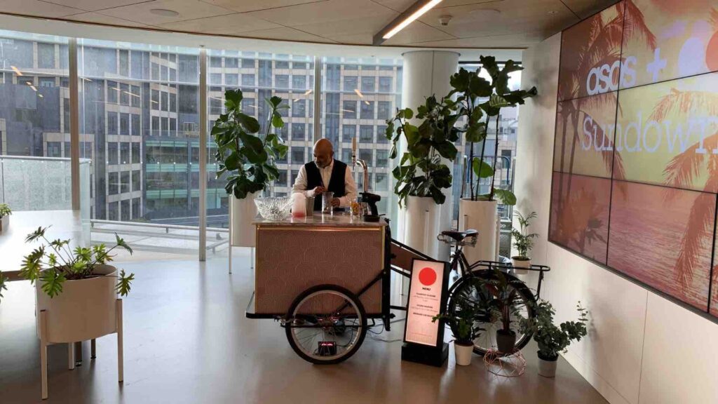 Mixologist preparing mocktails on trike bar.
