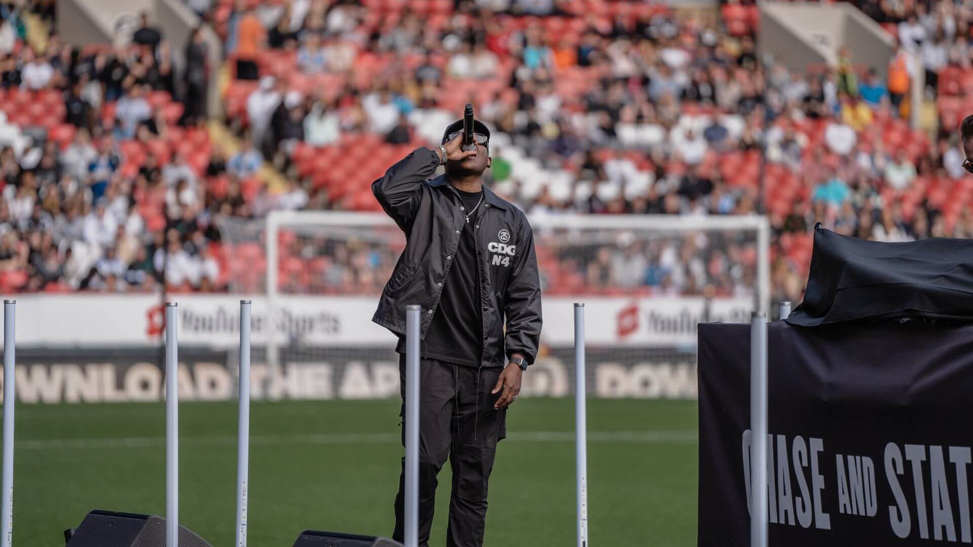 Sidemen Charity Football Match 2022 Chase and Status Pre Match performance on pitch.