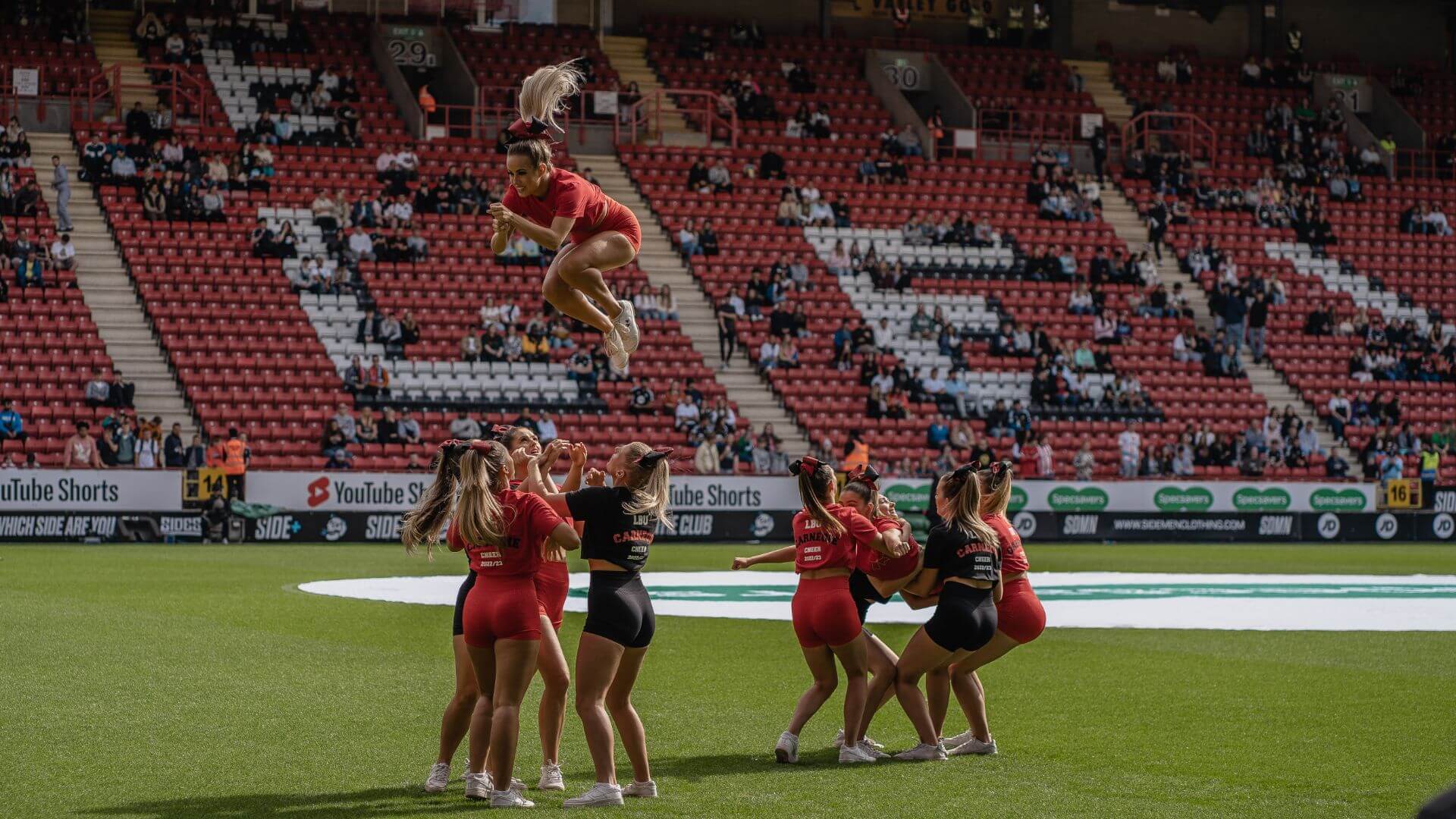 Cheerleaders performing on pitch at the Sidemen 2022 Charity Football Match.